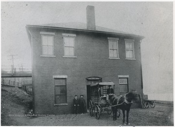 Man to the left is Simms Wicker's father. Other persons unidentified.