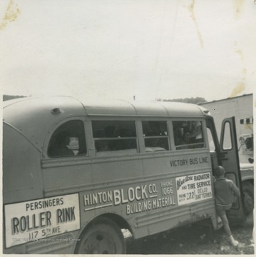 Swimming students board the Victory Bus Line owned by Mr. Fox.