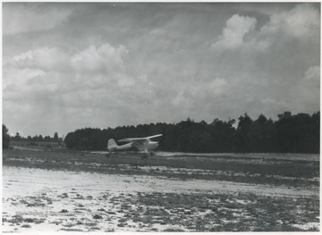 An airplane prepares to take off from the field.