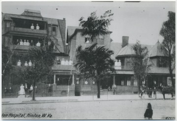 Located on the corner of Temple Street and 4th Avenue. Nurses in uniform pose on the balconies. Subjects unidentified. 