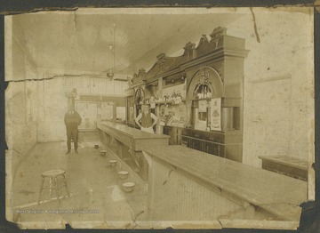 A bartender and unidentified man pictured inside the bar. 