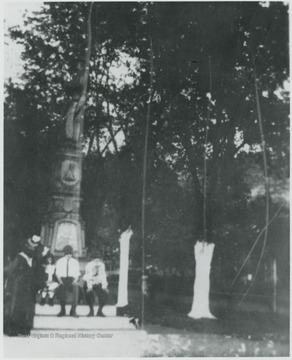 Members of the Faulkner family pictured beside the monument located at Courthouse Square. 