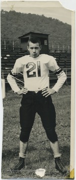 Woods pictured in his Bobcats team uniform in front of the bleachers. 