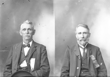 Man on right wears a ribbon that says "Preston County Soldiers' Reunion July 2, 3, and 4 Kingwood, W. Va.".