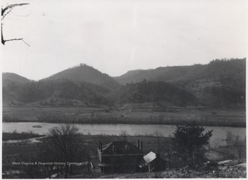 The home is pictured next to the river which flows toward the mouth of Indian Creek. 