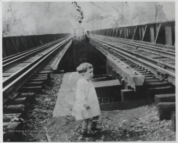 Vada Gaines Lively, Harry Lively's daugher, is pictured between the tracks. 