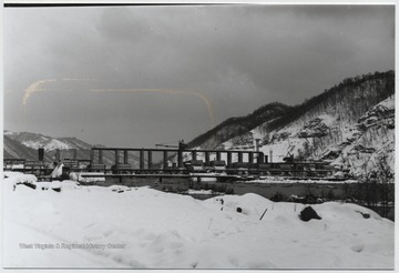 Looking at the snow-covered site from across the river. 