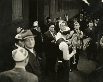 The group of musicians is likely the Rhythm Rangers. These musicians, like all employees of the "It's Wheeling Steel" radio broadcast, were either employees or family members of employees of the Wheeling Steel Corporation. This radio broadcast was company advertising executive John L. Grimes idea to promote both the company's product and its employees. It began broadcasting in 1936 and ended in 1944.