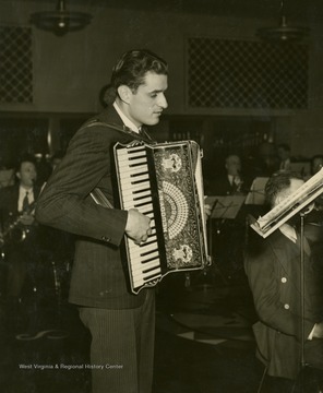 "Tony Biacco, steelmaker from Yorkville possesses two strong hands with which he capably handles ductillite and his accordion. His appearances on the family broadcast have been highly commendable. Now a regular in orchestra in 1943."