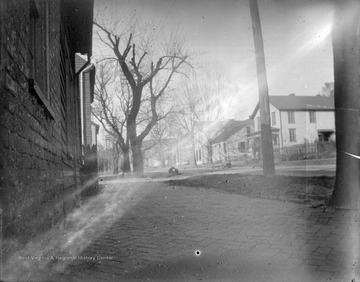 Appears to be two children playing in the street.