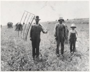 Moses Wyant, Jacob Henderon Allen, and Johnny Promry take a moment from their chores to pose for a photo.