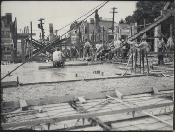 Men solidify an additional story to the Clark Hall building. Subjects unidentified. 