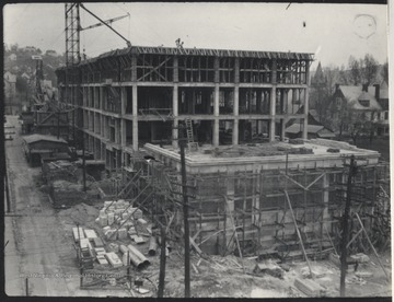 Construction matierials scatter around the site. 