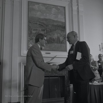 Gordon Gee presents Jim Benner with an Outstanding Teacher's Award at WVU.James W. Benner, M.A. was a faculty member in the College of Creative Arts at WVU.  He was a Professor of Music who taught Vocal Diction, Repertoire, Opera Theatre, and Piano at the undergraduate and graduate level. Benner directed 38 productions of 34 different operas with the WVU Opera Theatre.  His wife, the American soprano opera singer Frances Yeend,  was a Lecturer in Music and Voice in the WVU College of Creative Arts after retiring from her Opera Career in 1966 when they both moved to Morgantown, W. Va.