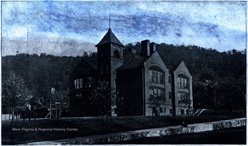 Negative of the first high school building constructed. 