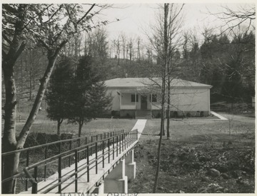 View of the school entrance from across the pedestrian bridge. 