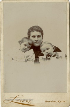 Portrait of Cousin Belle Ravenscroft, taken in Kansas, from a photograph album of late nineteenth century images featuring residents from Keyser, W. Va.