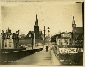 This image is part of the Thompson Family of Canaan Valley Collection. The Thompson family played a large role in the timber industry of Tucker County during the 1800s, and later prospered in the region as farmers, business owners, and prominent members of the Canaan Valley community."Church from Baltimore St., Cumberland Md. near W.M.R.R. [Western Maryland Railroad]"