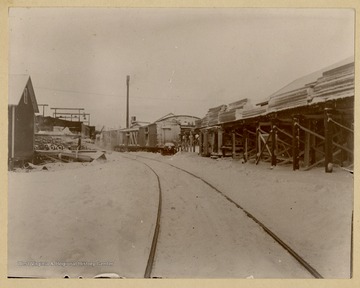 This image is part of the Thompson Family of Canaan Valley Collection. The Thompson family played a large role in the timber industry of Tucker County during the 1800s, and later prospered in the region as farmers, business owners, and prominent members of the Canaan Valley community.In the background, the stack belongs to the First Electric Plant in central W. Va. It was heated by coal boilers.  The view shows the Thompson Lumber mill, later the Blackwater and Boom Lumber Company.