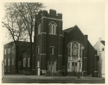 This building on West King Street of Martinsburg "is the second building on this same plot of land; this building was built in 1913 -- the educational building seen on the rear of the church edifice was built in 1925. The stone building seen in the right of the photo was purchased in 1925 by the church.  This stone building has been here for many years and has a long history of use by many businesses."