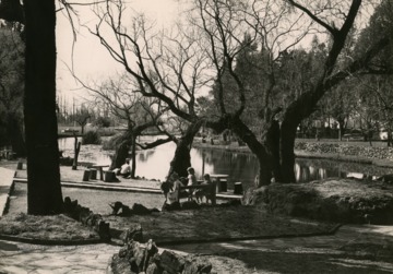 Individuals at the Eye of the Kuruman, a natural spring in Northern Cape, South Africa.    