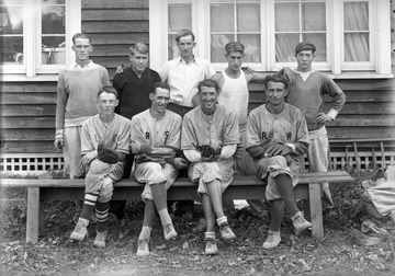 A group of unidentified boys pose for a group photo. 