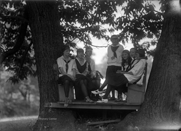 A group of unidentified girls are gathered. 