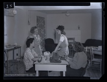 Women design hats and bags during their time at the camp.