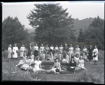 A group of girls pose in their fashion show costumes. 