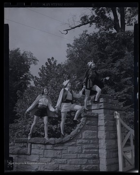 Three girls wearing costumes act of the 'Three Princes of Serendip.'