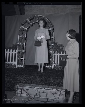 Two unidentified women show off their style.