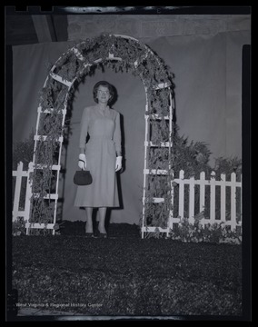 An unidentified woman poses on stage during the fashion show. 