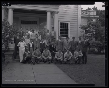 Photo description reads, "Good Grooming." The boys are gathered in front of a building to take a picture. Subjects unidentified. 