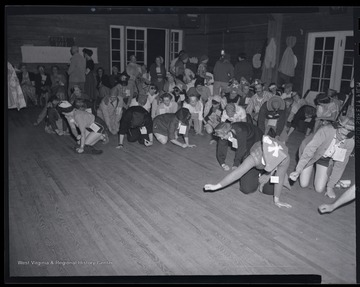 A group of men and women play games at the leadership conference. Subjects unidentified. 