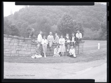 A group of Europeans are positioned along the wall during the Volunteer Leaders Conference. Subjects unidentified. 