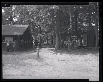 A group lines up outside of the trailer, waiting to enter the exhibition. 