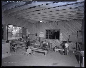 An unidentified boy is pictured beside the machinery. 