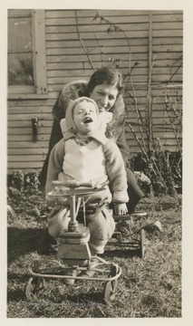 Pearl S. Buck with her only biological daughter, Carol Grace Buck, outside a home.