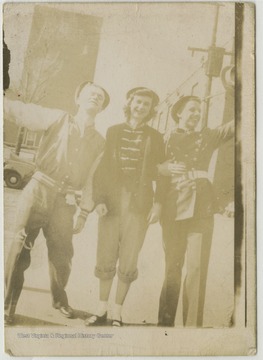 Josephine Davis, center, poses with two unidentified classmates outside the high school building. 