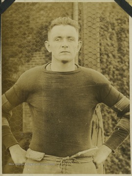 A West Virginia University football player identified as "Rhodes" is pictured in his practice gear. 