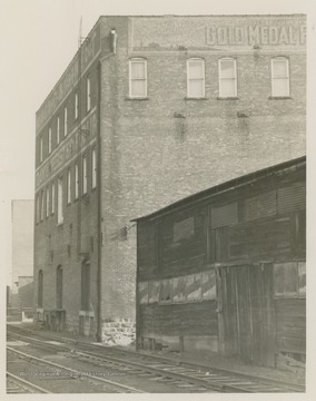 Rear of the Morgantown Flour & Feed Co., which is alongside the railroad tracks.