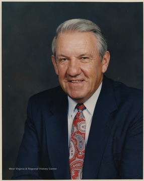 Schaus played basketball for WVU in 1946-1949. He coached in 1954-1960 and served as the Athletic Director for the West Virginia University Mountaineers. He left WVU in 1960 to become the head coach and subsequent general manager for the Los Angeles Lakers. 