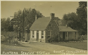 Station advertising American Amoco Gas at its gasoline pumps. 