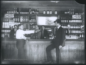 The man on the left points a gun at the man on the right, who is also reaching for his gun.  Subjects unidentified. 