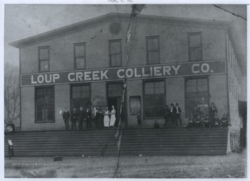 Men and women are pictured outside of the store entrance. 