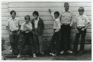 Six boys sport their junior deputy badges during the Good Neighbor Day event. 