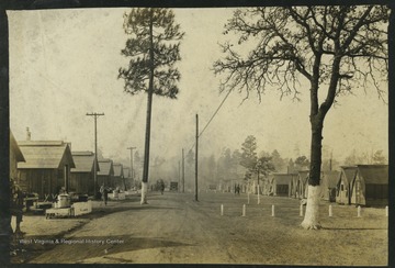 Pre-WWII photograph of the military camp from an album belonging to W. S. Wilkin.The 100th division was headquartered in Wheeling in 1924 and in Charleston in 1937, but was disbanded due to a lack of service in the interwar years. It was reactivated in November 1942 and sent to Marseille, France in October 1944 after extensive combat training. Today, the division serves as a major training command of the United States Army Reserve. 