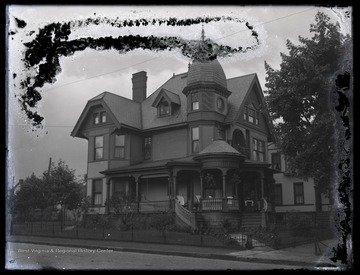 Street view of a Victorian style home. 