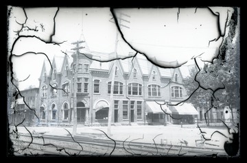 View of the building, on the corner of Railroad Street and Main Street, from across the railroad tracks.