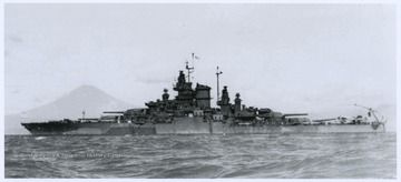 The battleship is anchored in Sagami Wan, which is located just outside of Tokyo Bay. In the background is Mount Fuji.